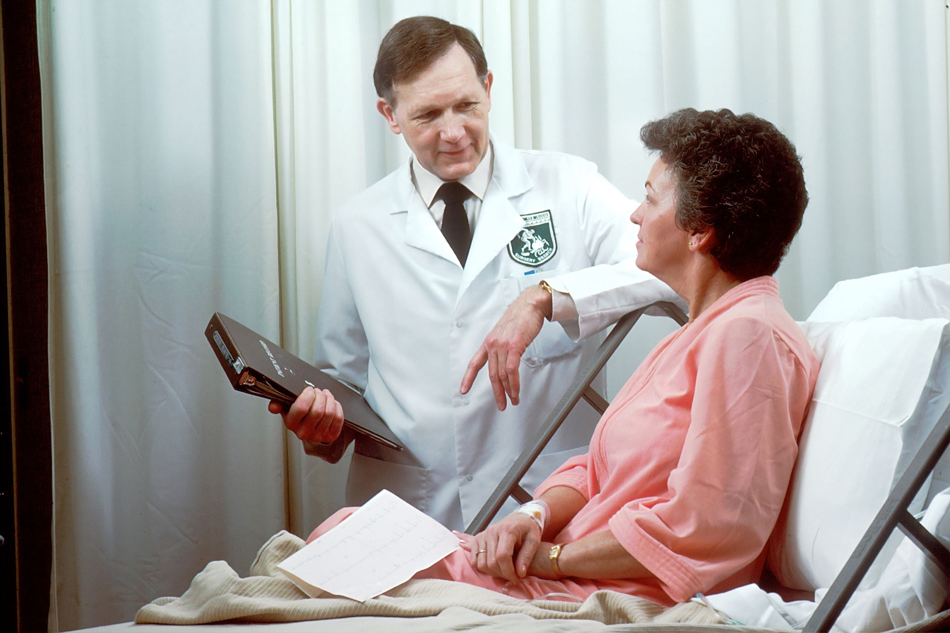 A male Doctor discussing with a female patient 